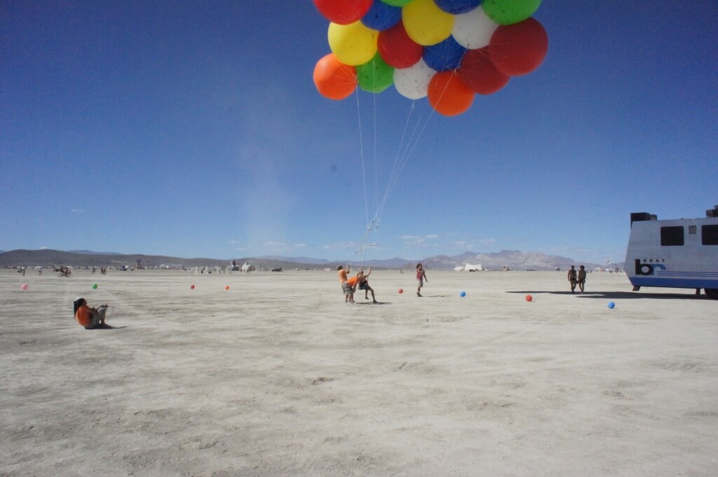 A person ready to take flight on weather balloons